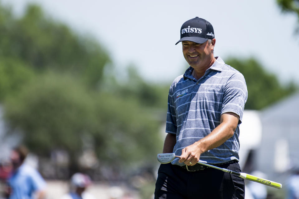 Ryan Palmer cracks a smile after chipping to the ninth hole during the second round of the AT&T Byron Nelson golf tournament in McKinney, Texas, on Friday, May 13, 2022. (AP Photo/Emil Lippe)