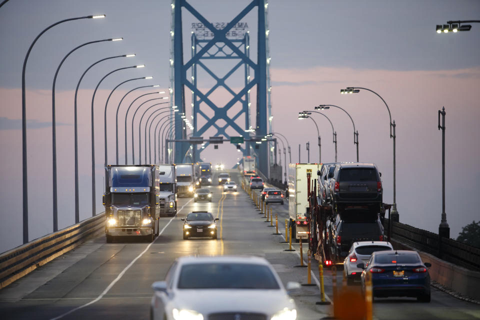 Commercial trucks and passenger vehicles drive across Ambassador Bridge on the Canada-U.S. border in Windsor, Ontario, Canada, on Thursday, Aug. 9, 2018. The Ambassador Bridge connects Canada to USA, from Windsor to Detroit and facilitates over 30 per cent of all Canada-US road trade. (Photo from Cole Burston/Bloomberg via Getty Images)