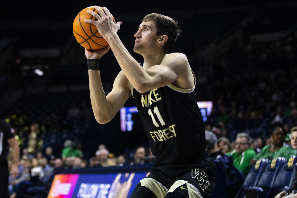 FILE - Wake Forest's Andrew Carr (11) lines up a shot during the first half of an NCAA college basketball game against Notre Dame, Feb. 4, 2023 in South Bend, Ind. The Wake Forest Demon Deacons are trying to return to the NCAA Tournament for the first time since 2017. (AP Photo/Michael Caterina, File)