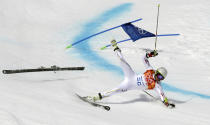 Andorra's Joan Verdu Sanchez crashes in the first run of the men's giant slalom at the Sochi 2014 Winter Olympics, Wednesday, Feb. 19, 2014, in Krasnaya Polyana, Russia. (AP Photo/Charles Krupa)