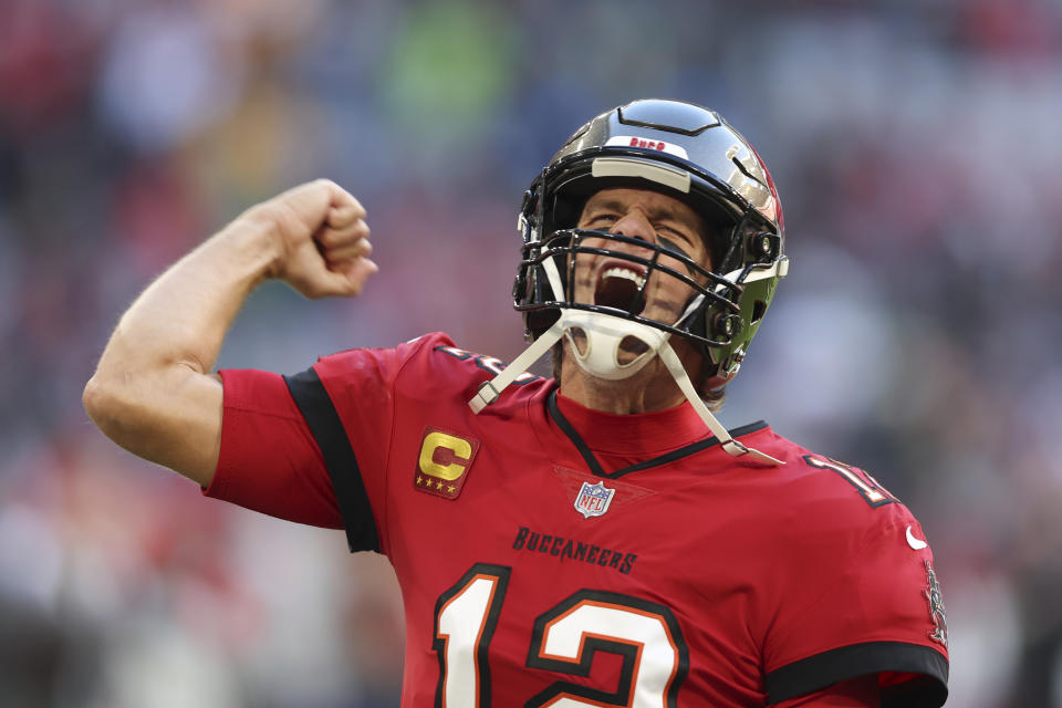 Tampa Bay Buccaneers quarterback Tom Brady runs onto the field before an NFL football game against the Seattle Seahawks, Sunday, Nov. 13, 2022, in Munich, Germany. (AP Photo/Gary McCullough)