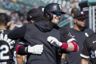 Chicago White Sox catcher Yasmani Grandal, right, celebrates his solo home run with Billy Hamilton in the fourth inning of a baseball game against the Detroit Tigers in Detroit, Monday, Sept. 27, 2021. (AP Photo/Paul Sancya)