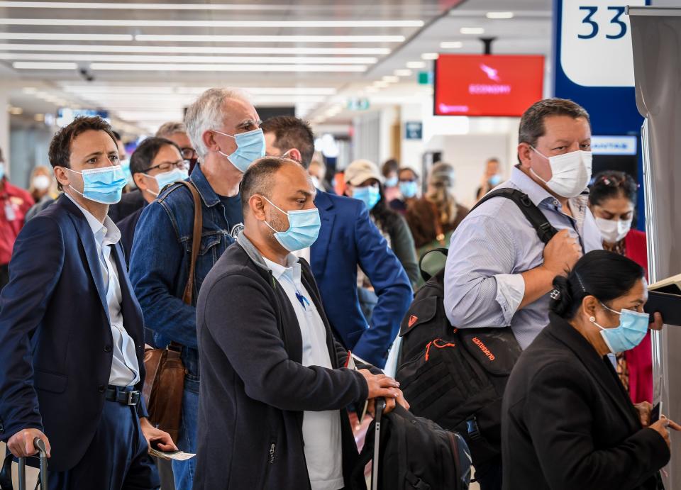 SYDNEY, AUSTRALIA - APRIL 19: Passengers wearing face masks wait to board their flight bound for New Zealand at Sydney's Kingsford Smith Airport on April 19, 2021 in Sydney, Australia. The trans-Tasman travel bubble between New Zealand and Australia begins on Monday, with people able to travel between the two countries without needing to quarantine. (Photo by James D. Morgan/Getty Images)