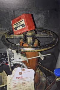 <span class="icon icon--xs icon__camera">  </span> <span class="credit font--s-m upper black"> <b>LAW OFFICES OF ROBERT MONGELUZZI</b> </span> <div class="caption space-half--right font--s-m gray--med db"> The water valve for the sprinkler system, with the red cover detached from the water-sensor alarm. </div>