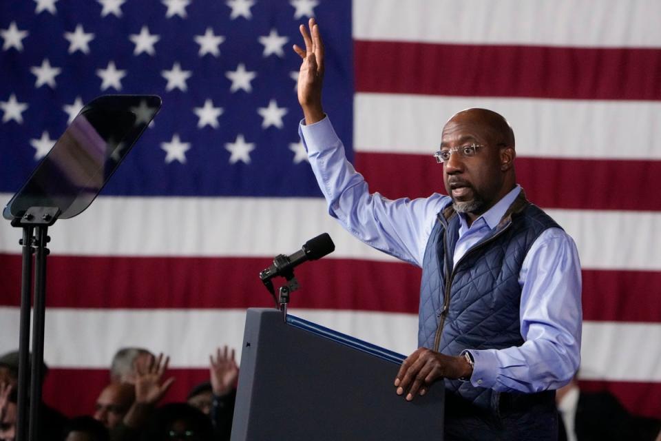 Georgia senator Raphael Warnock has been campaigning with Joe Biden (AP)