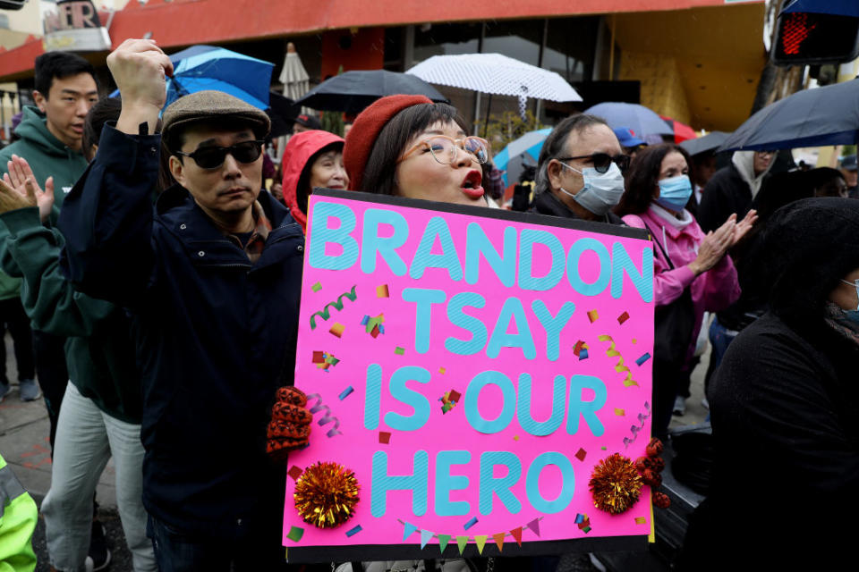 Becki Pang, center, cheers for Brandon Tsay, 26, after he was awarded a medal of courage from the Alhambra Police Department during a ceremony at the the Alhambra Lunar New Year Festival on Jan. 29, 2023 in Alhambra, Calif.<span class="copyright">Gary Coronado—Los Angeles Times via Getty Images</span>