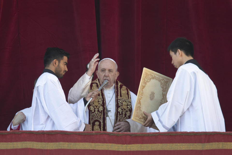 Pope Francis delivers the Urbi et Orbi (Latin for 'to the city and to the world' ) Christmas' day blessing from the main balcony of St. Peter's Basilica at the Vatican, Wednesday, Dec. 25, 2019. (AP Photo/Alessandra Tarantino)