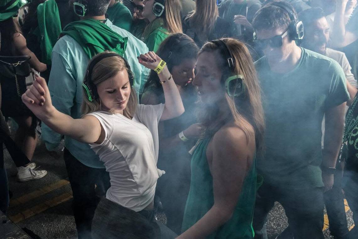 St. Pat’s in Five Points festivalgoers dance in the Silent Disco tent.