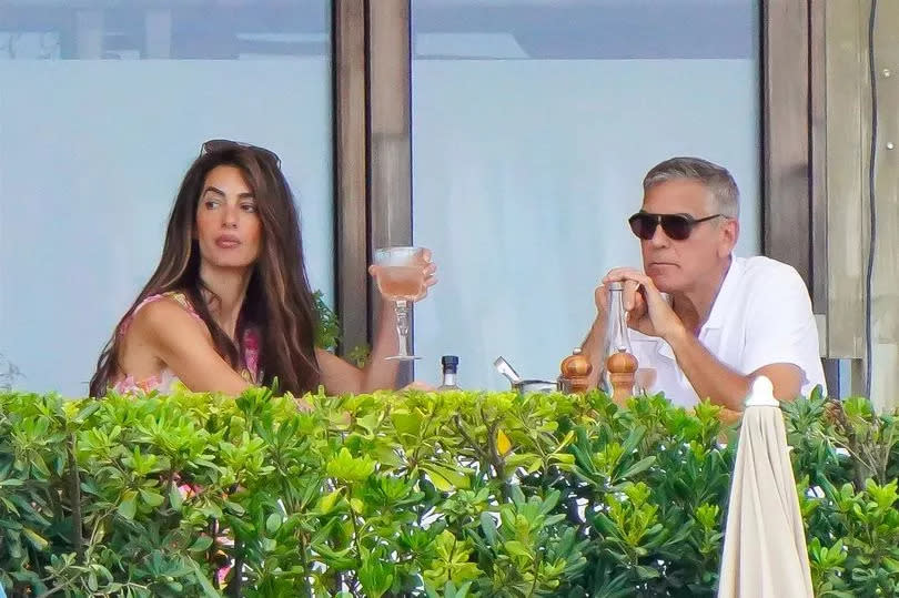 George Clooney and his wife, Amal, were spotted enjoying a leisurely lunch at the famous Jardin Tropezina restaurant during their luxurious vacation in St-Tropez.