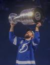 Tampa Bay Lighting's Victor Hedman carries the Stanley Cup while skating around Amalie Arena, Tuesday, Sept. 29, 2020, in Tampa, Fla. (Dirk Shadd/Tampa Bay Times via AP)