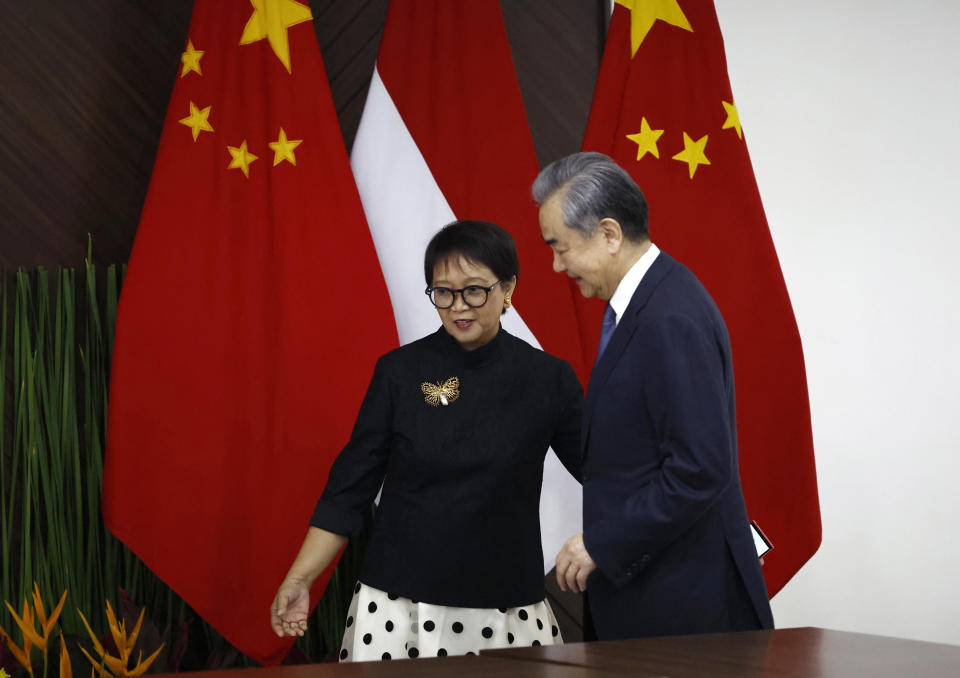 Chinese Foreign Minister Wang Yi, right, walks with Indonesian Foreign Minister Retno Marsudi during their bilateral meeting in Jakarta, Indonesia, Thursday, April 18, 2024. (Willy Kurniawan/Pool Photo via AP)