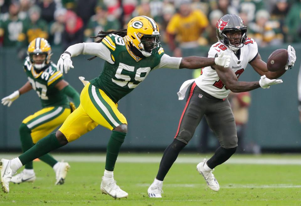 Tampa Bay Buccaneers wide receiver David Moore breaks away from Green Bay Packers linebacker De'Vondre Campbell for a 52-yard touchdown reception during their  game on Sunday.