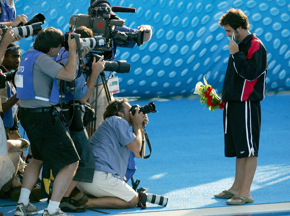 MONTREAL - JULY 19: Alexandre Despatie of Canada poses with his gold medal in the three meter diving final on the podium during the XI FINA World Championships at the Parc Jean-Drapeau on July 19, 2005 in Montreal, Quebec, Canada. (Photo by Al Bello/Getty Images)