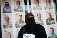 Indira Sinanovic, first Bosnian woman wearing niqab to run in local election in Bosnia, shares promotional material in Zavidovici, Bosnia and Herzegovina, September 27, 2016. REUTERS/Dado Ruvic