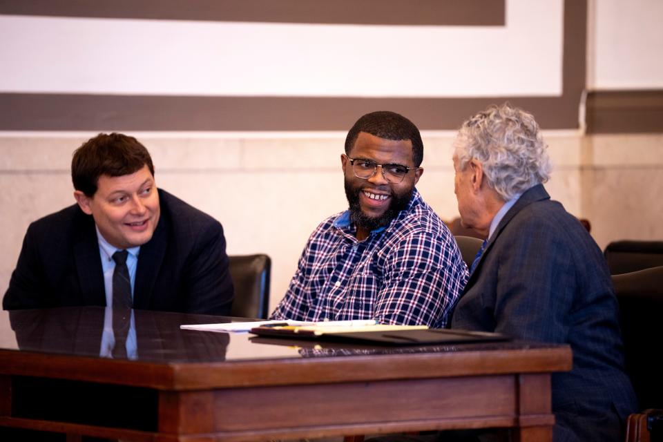 Marcus Sapp, center, sits in court with his attorneys, Eric Eckes, left, and Martin Pinales during a hearing at the Hamilton County Courthouse in January. Sapp spent more than a decade in prison for murder after informant Quincy Jones testified against him. A judge granted him a new trial.