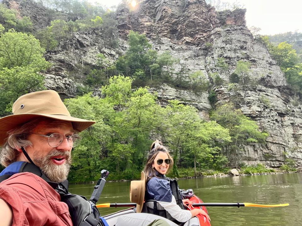 Scott “Doc” Varn and Sophia Michelen were escorted up the French Broad River in Hot Springs in a kayak by Marshall resident Sarah Jones Decker.