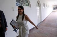 First lady communications director Stephanie Grisham walks at the White House in Washington