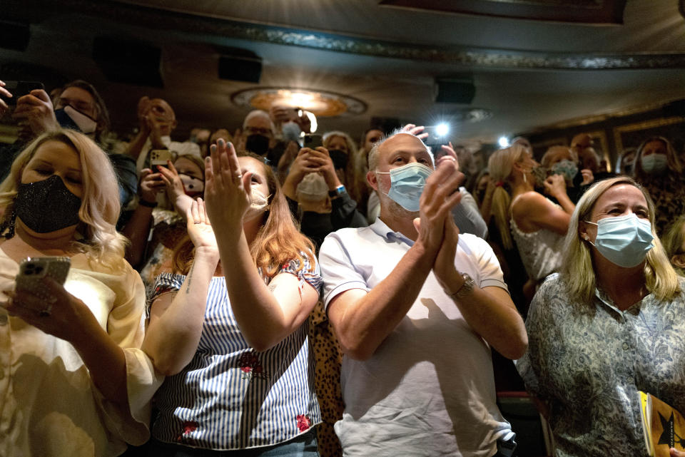 The audience applauds as "Hamilton!" creator Lin-Manuel Miranda gives a curtain speech at the Richard Rodgers Theatre, in New York, as the show opened Tuesday, Sept. 14, 2021, after being closed in early 2020 due to COVID-19 concerns. (AP Photo/Craig Ruttle)