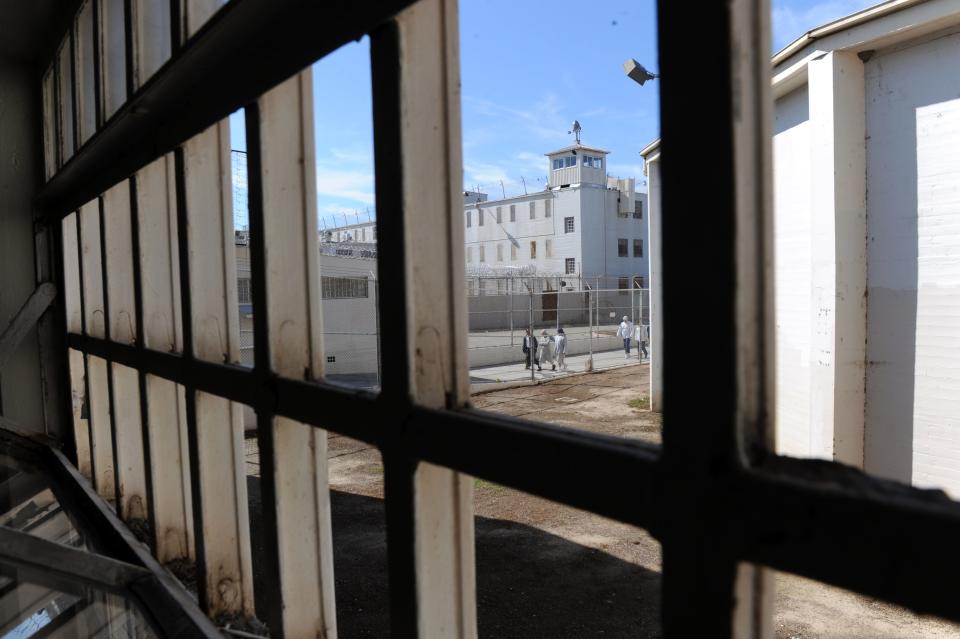 File photo - Inmates are seen March 2, 2012 returning inside to Deuel Vocational Institution in Tracy. The prison closed on Sept. 30, 2021.