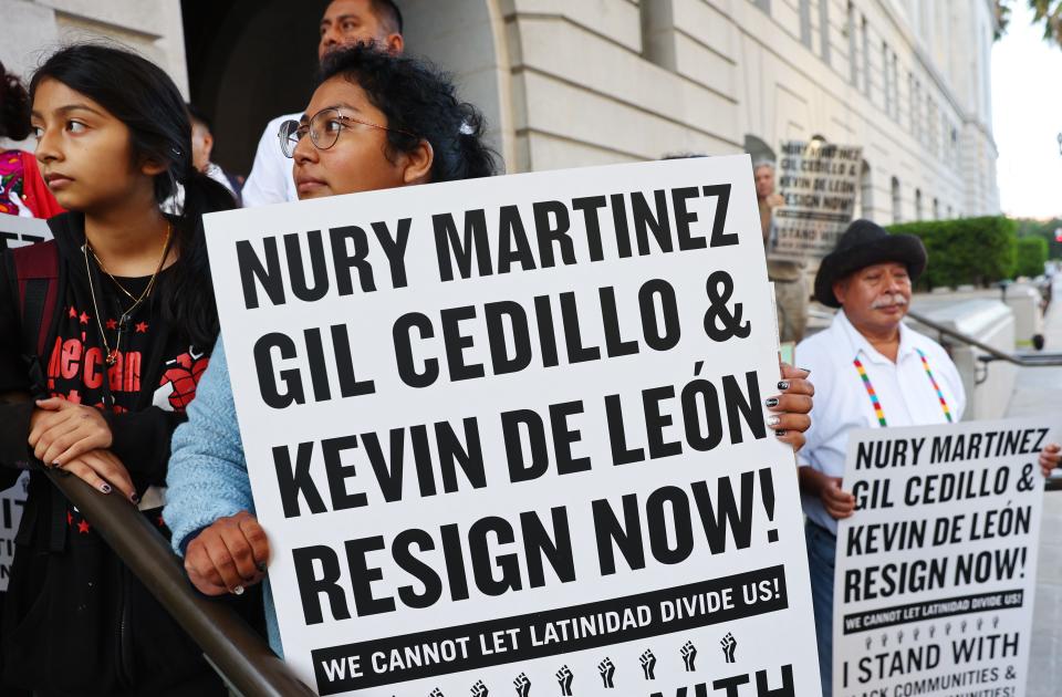 Protestors demonstrate outside City Hall, calling for the resignations of L.A. City Council members Kevin de Leon and Gil Cedillo in the wake of a leaked audio recording on Oct. 12, 2022, in Los Angeles, California. L.A. City Council President Nury Martinez resigned in the aftermath of the release of the profanity-laced recording, which revealed racist comments amid a discussion of city redistricting.