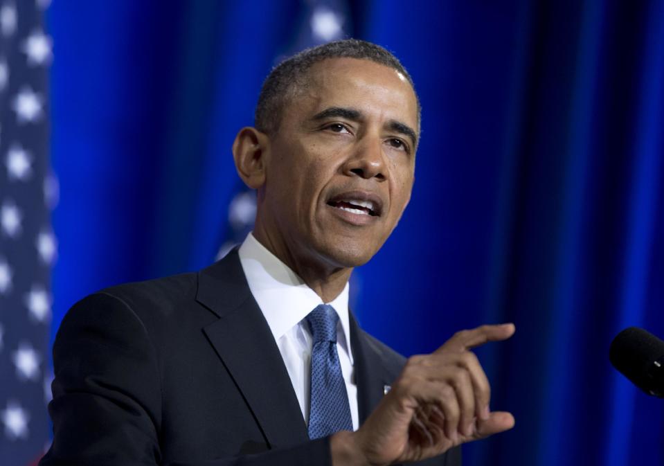 President Barack Obama talks about National Security Agency (NSA) surveillance, Friday, Jan. 17, 2014, at the Justice Department in Washington.Seeking to calm a furor over U.S. surveillance, the president called for ending the government's control of phone data from hundreds of millions of Americans and immediately ordered intelligence agencies to get a secretive court's permission before accessing the records. (AP Photo/Carolyn Kaster)