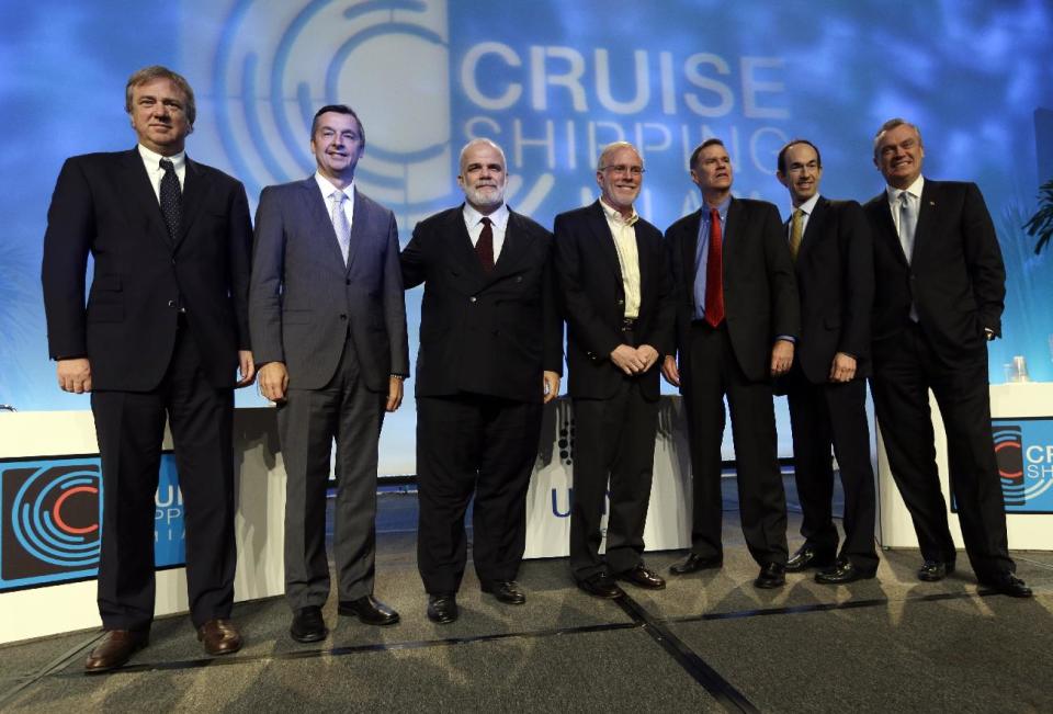 Panelists pose for a group photograph following the State of the Industry session at the 29th annual Cruise Shipping Miami conference, Tuesday, March 12, 2013, in Miami Beach, Fla. From left to right are Pierfrancesco Vago, CEO of MSC Cruises, Michael Bayley, president and CEO of Celebrity Cruises, Manfredi Lefebvre d'Ovidio, chairman of Silversea Cruises, Kevin Sheehan, CEO of Norwegian Cruise Line, Gerry Cahill, president and CEO of Carnival Cruise Lines, Adam Goldstein, president and CEO of Royal Caribbean International, and Stein Kruse, president and CEO of Holland America. (AP Photo/Lynne Sladky)