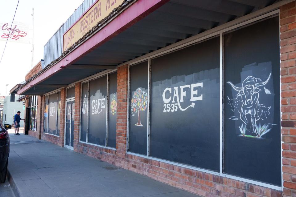 The storefront of Cafe 25:35 in downtown Buckeye, Ariz., includes artwork to view as you stroll the sidewalk, photographed on Dec. 23, 2022.