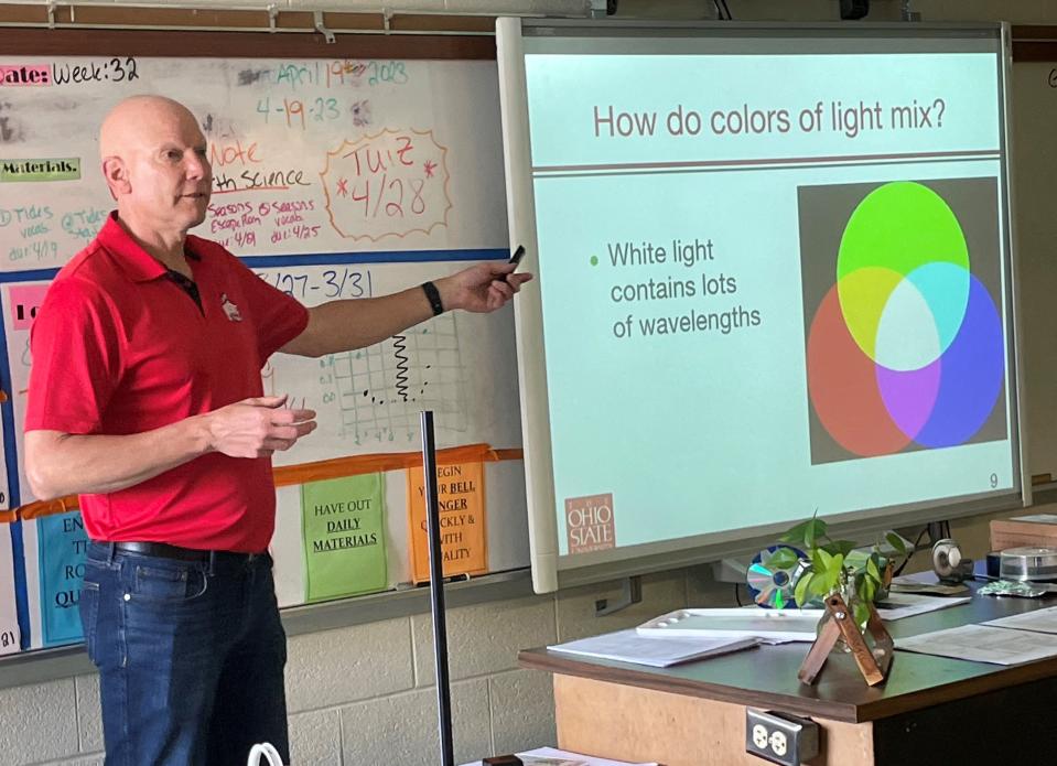 Mark Morscher of Granville, a retired electrical and computer engineer, discusses how light breaks down into wavelengths to form the color spectrum during a STEM project last week at Utica Middle School. Morscher travels to various Licking County schools through the Ohio State University College of Engineering.