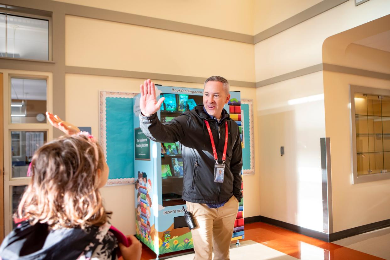 Malabon Elementary Principal Nathan Bridgens greets students during the first day of school.