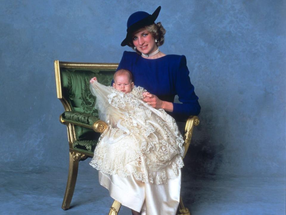 Princess Diana holds Prince Harry at his christening in 1984.