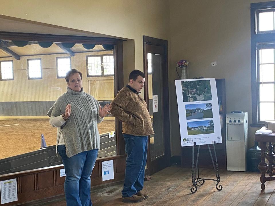 Angela Eisaman, with her son, Mitchell, talks Monday at Raemelton Therapeutic Equestrian Center about the capital campaign to build a Taking Root Farms facility to provide day-habilitation services to adults with disabilities.