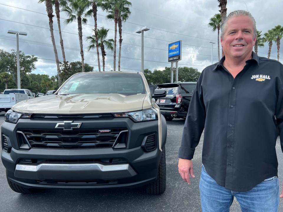 Matt Kelly, general sales manager at Jon Hall Chevrolet in Daytona Beach, stands next to a Chevy Colorado pickup on Friday, Sept. 15, 2023. Dealership owner Glenn Ritchey said he has new Colorados in stock for now, but would be concerned if the UAW strike that began Friday at the General Motors plant in Missouri that makes them goes for an extended period of time.