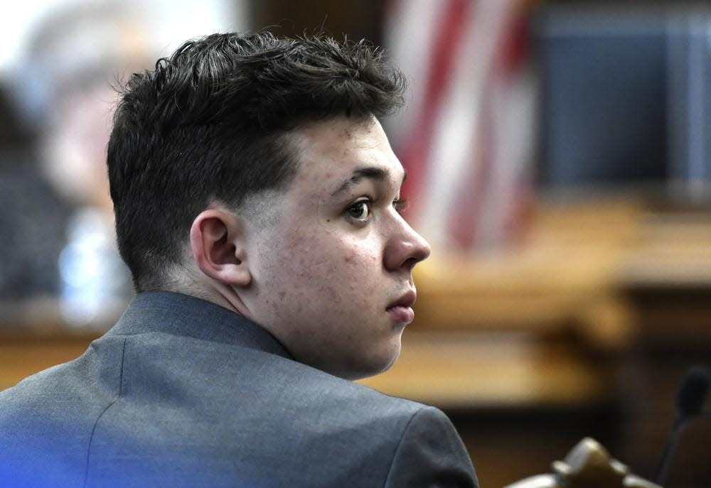 Kyle Rittenhouse looks back at the potential juror pool during the jury selection process at the Kenosha County Courthouse in Kenosha, Wis., Monday, Nov. 1, 2021. (Sean Krajacic/The Kenosha News via AP, Pool)