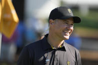 International team captain Trevor Immelman walks on the fifth green during practice for the Presidents Cup golf tournament at the Quail Hollow Club, Tuesday, Sept. 20, 2022, in Charlotte, N.C. (AP Photo/Chris Carlson)