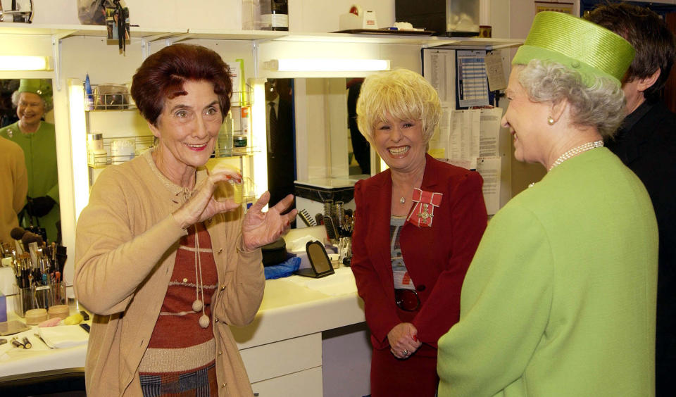 The Queen during her visit, to Elstree Studios where the famous British soap EastEnders is filmed. The Queen was accompanied by long standing cast member Barbara Windsor, who plays Peggy Mitchell and she met in the make up room June Brown, who plays Dot Cotton.   (Photo by Fiona Hanson - PA Images/PA Images via Getty Images)