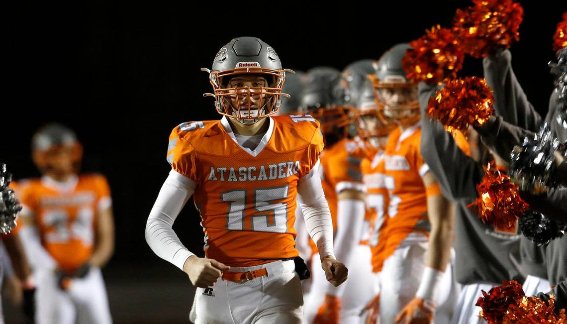 Grey quarterback Kane Cooks (15). Atascadero High School Greyhounds beat Dos Palos Broncos 35-0 in the prep football semi-finals, Friday, Nov. 18, 2022.