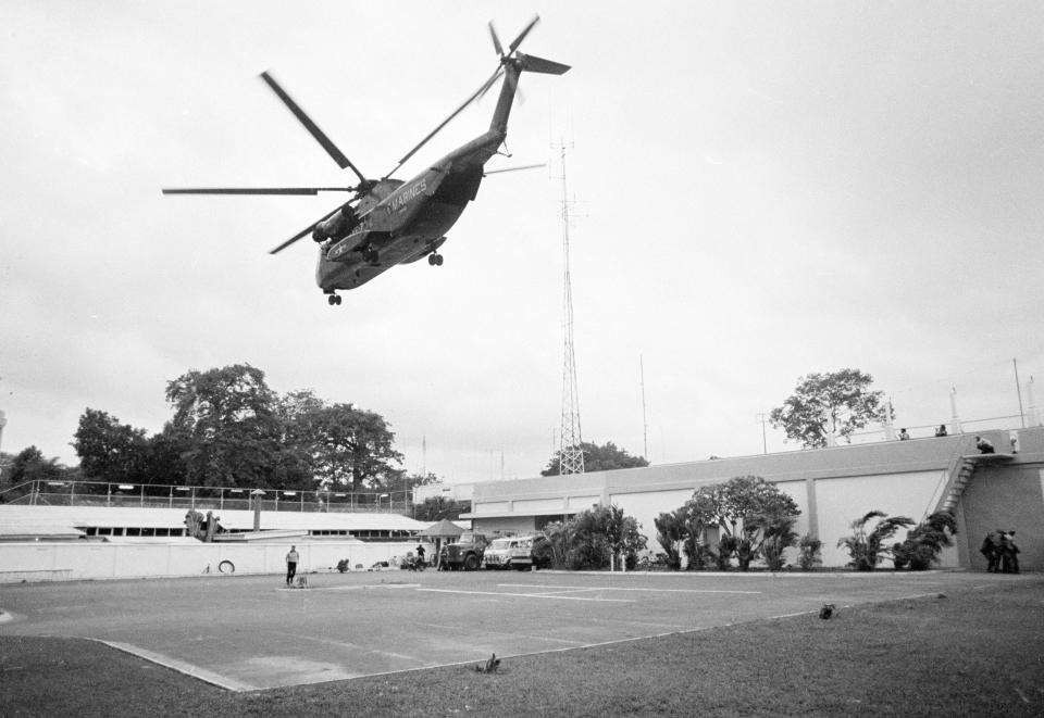 FILE - In this April 29, 1975, file photo the helicopter zone at the U.S. Embassy in Saigon, Vietnam, showing last minute evacuation of authorized personnel and civilians. With U.S. and NATO forces under a Sept. 11, 2021, deadline to leave Afghanistan, many are recalling that desperate, hasty exodus as they urge the Biden administration to evacuate thousands of Afghans who worked as interpreters or otherwise helped U.S. military operations there in the past two decades. (AP Photo, File)