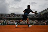 Italy's Fabio Fognini plays a forehand return to Italy's Andreas Seppi during their men's singles first round match on day three of The Roland Garros 2019 French Open tennis tournament in Paris on May 28, 2019. (Photo by Anne-Christine Poujoulat/AFP/Getty Images)