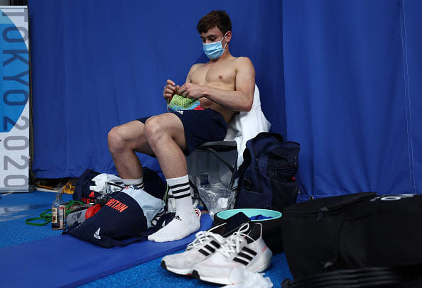 <div class="inline-image__caption"> <p>Tom Daley knitting before the Men’s 10m Platform Final on Day 15 of the Tokyo Olympic Games on Aug. 7, 2021.</p> </div> <div class="inline-image__credit"> Clive Rose/Getty </div>