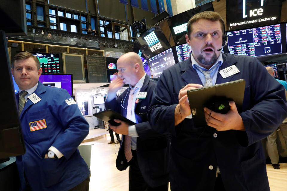 Traders work on the floor at the New York Stock Exchange (NYSE) in New York, U.S., January 9, 2020. REUTERS/Brendan McDermid