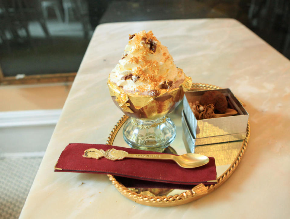 <p>This $25,000 Frrrozen Haute Chocolate from Serendipity 3 is made with 28 different cocoas. If that’s not fancy enough for you, the dessert is also topped off with some dusted 23-karat edible gold and served with a side of La Madeline au Truffle from Knipschildt Chocolatier, priced at $2,600 per pound itself. <i>(Photo Credit: Getty Images)</i></p>