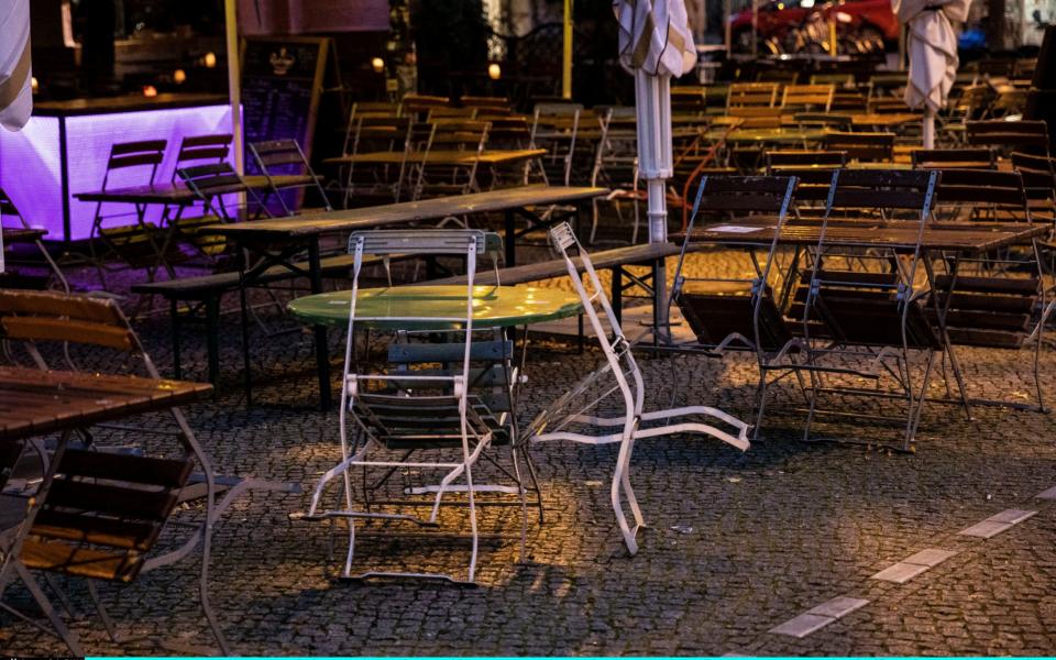 BERLIN, GERMANY - OCTOBER 15: Chairs are set together outside a restaurant on October 15, 2020 in Berlin, Germany. Due to the significant increase in coronavirus infections, most stores and all restaurants and bars in Berlin have to close from 11 p.m. to 6 a.m. in the future. On Tuesday (October 6, 2020), the Senate passed a night-time curfew. Clubs, which have been closed for months, are struggling to stay alive. (Photo by Maja Hitij/Getty Images) - Maja Hitij/Getty Images Europe