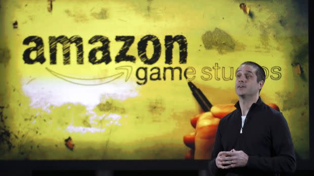 Amazon&#39;s vice president of games, Mike Frazzini speaks to media as he displays the Amazon Fire TV during a news conference in New York