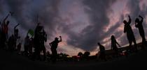 <p>People protest Monday, Aug. 18, 2014, for Michael Brown, who was killed by police Aug. 9 in Ferguson, Mo. (Charlie Riedel/AP) </p>