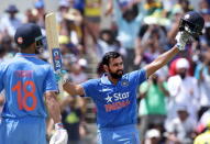 India's Virat Kohli (L) watches as teammate Rohit Sharma celebrates after reaching his century during their One Day International cricket match against Australia in Perth January 12, 2016. REUTERS/Bill Hatto