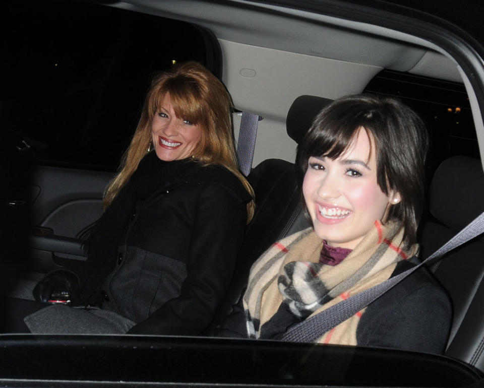 Actress, singer Demi Lovato (R) and her mother leave her hotel on January 30, 2009 in New York City