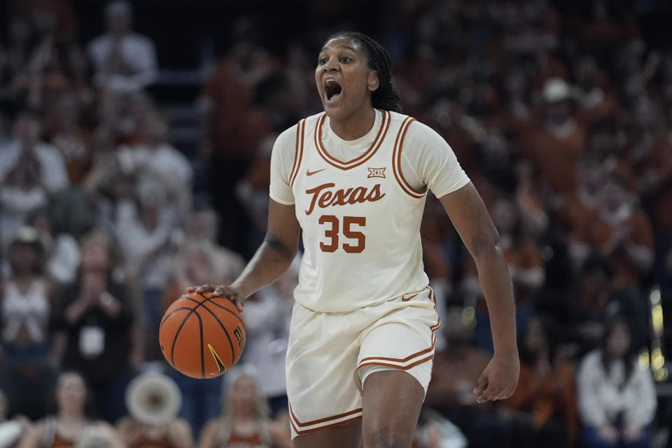 Texas forward Madison Booker (35) moves the ball upcourt against BYU during the second half of an NCAA college basketball game in Austin, Texas, Saturday, March 2, 2024. (AP Photo/Eric Gay)