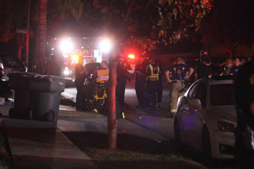 Police and emergency personnel work at the scene of a shooting at a backyard party, Sunday, Nov. 17, 2019, in southeast Fresno, Calif. (Photo: Larry Valenzuela/The Fresno Bee via AP)