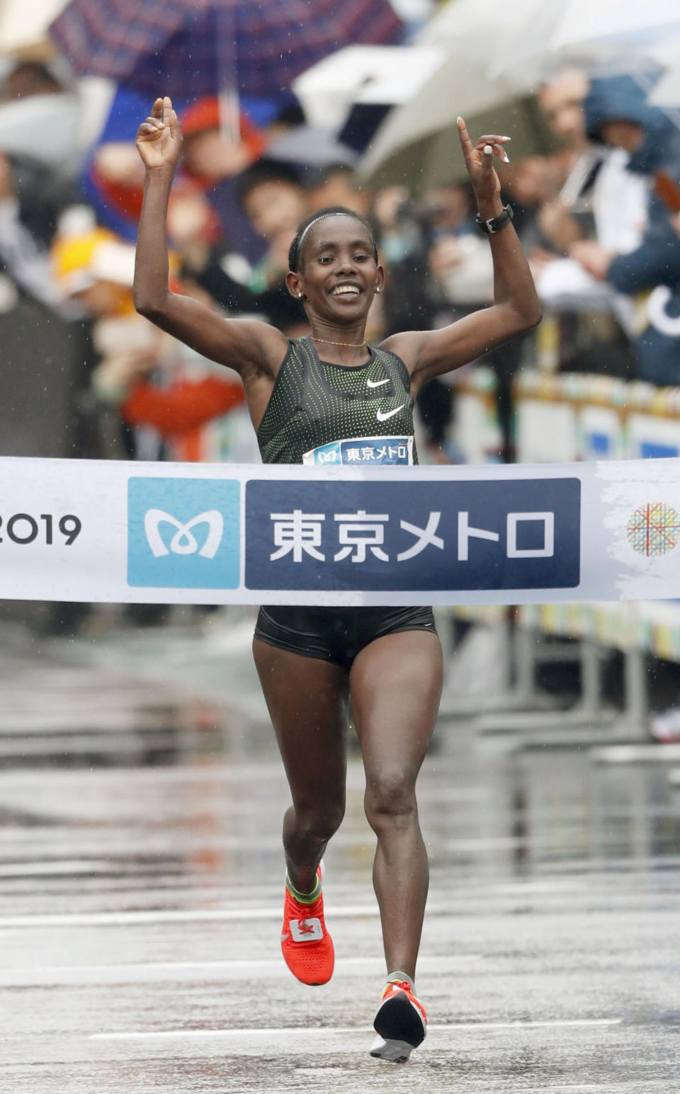 Ruti Aga of Ethiopia crosses the finish line, winning the Tokyo Marathon in Tokyo, Sunday, March 3, 2019. (Jun Hirata/Kyodo News via AP)