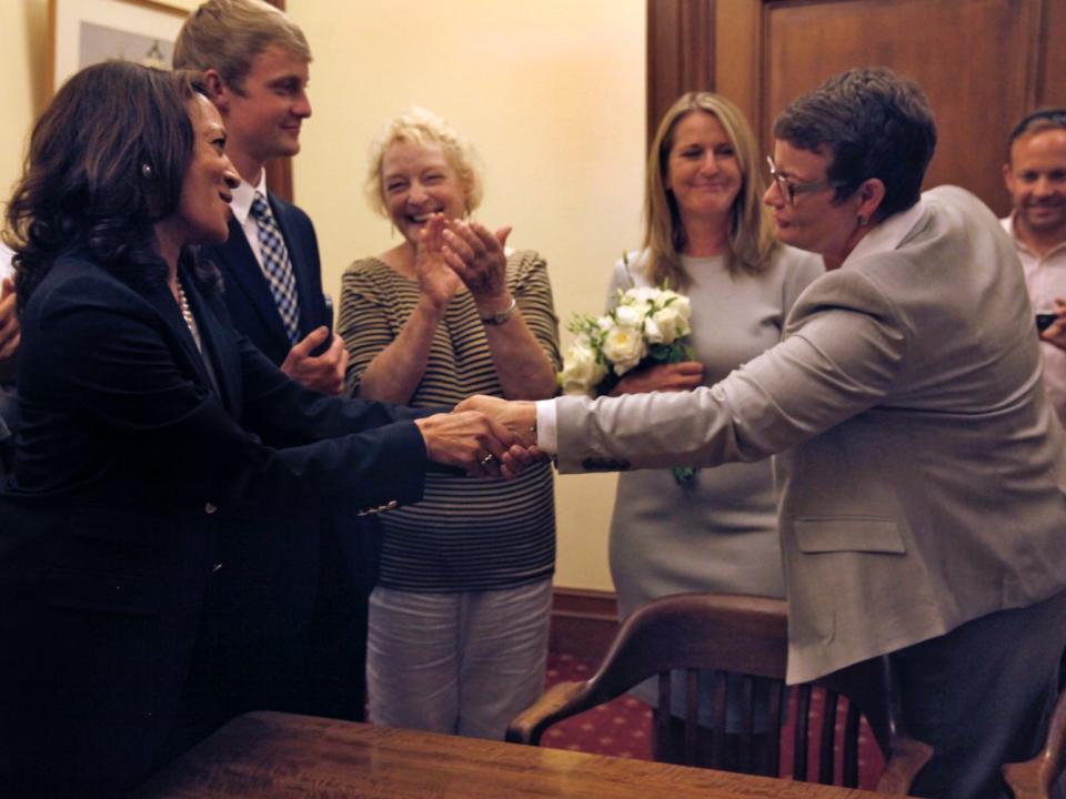 Kamala Harris congratulating Sandy Stier and Kris Perry on their marriage in the mayor's office in San Francisco, California, on Friday, June 28, 2013.